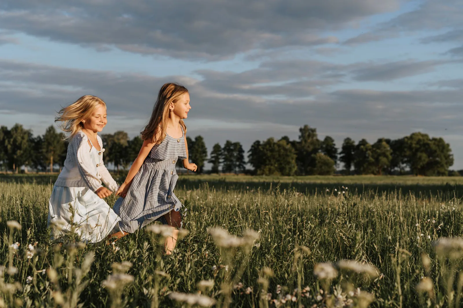 Children running joyfully through a field